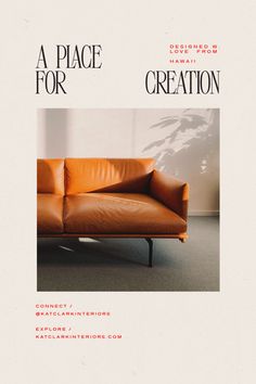 a leather couch sitting on top of a carpeted floor next to a white wall