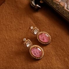 Unveil the elegance of the Pink Pihu CZ Kundan Earrings, a true testament to Indian and Pakistani jewelry heritage. These breathtaking pink earrings, embellished with radiant ruby stones and intricate CZ and kundan craftsmanship, are perfect for adding a touch of opulence to any outfit. Whether for a special occasion or everyday glamour, their luxurious design and impeccable artistry make them an essential addition to any jewelry collection. Celebrate the beauty and sophistication of South Asian Asian Jewelry, Polki Jewellery, Bangle Ring, Kundan Earrings, Pakistani Jewelry, Ruby Stone, Natural Stone Jewelry, Oxidised Jewellery, Temple Jewellery