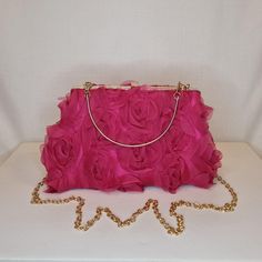 Womens fuschia pink all-over ruffle floral rose pattern evening clutch bag with gold metalwork and top closing clasp Can be used with or without long shoulder chain or small handle (both included) size approx- H 14cm x W 24cm Optional Dust Bag: White lightweight soft polyester portable travel dust bag pouch, suitable for protecting items from dust, dirt, hairs and scratches when not in use size approx- L 47cm x W 31.5cm Material: 100% polyester Please note, there is a cut in the top corner of th Hot Pink Bag, Hot Pink Floral, Shoulder Chain, Evening Clutch Bag, Evening Clutch, Rose Pattern, White Bag, Clutch Handbag, Pink Bag