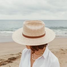 A little western and a little unexpected in the best ways - meet the Moonlight straw rancher, a statement hat that's not just for country concerts and riding horses. Part of our premium straw hat collection, the Moonlight is handcrafted with fine tripilla palm straw that's been sustainably harvested by artisans in Puebla, Mexico. Wear this straw hat for a long day outdoors, offering UPF 50+ sun protection and a large, structured, 4" brim to help shield your face from harmful rays. The cattleman style crown and toasted caramel straw color, gives the Moonlight that special western feel - complete with a removable, 100% genuine leather hatband with a gold hardware finish. Each handmade hat is unique and may have small imperfections or vary in size and color. • Organic and Plastic-free • Produ Statement Hat, Country Concerts, Hat Collection, Handmade Hat, Skin Care Gifts, Crossbody Tote, Hat Band, Long Day, Horse Riding