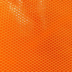 an orange background with circles and dots