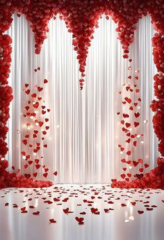 a white backdrop with red flowers and hearts on the curtain, in front of a window