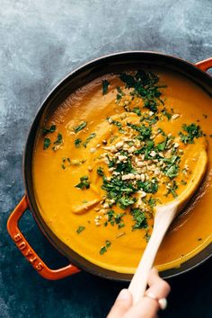 a bowl filled with soup and garnished with parsley