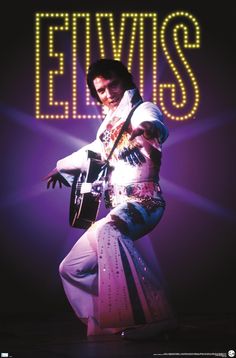 elvis presley on stage with the words let it miss in neon lights behind him and his guitar