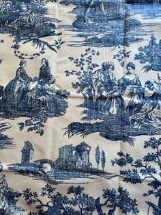 a blue and white toiler fabric with an image of people in the woods