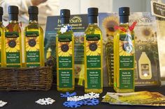 several bottles of sunflower oil sitting on a table