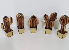 six wooden cactus planters sitting next to each other