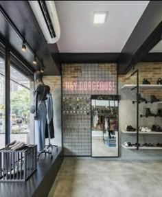 the inside of a shoe store with shoes on display