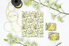 the supplies needed to make this diy wrapping paper are laid out on top of each other