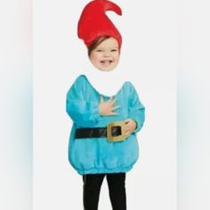 a child in a blue costume with a red hat