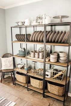 the shelves are filled with dishes and plates