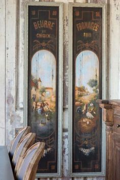 an old room with two paintings on the wall