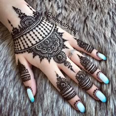 henna tattoo on the palm of someone's hand