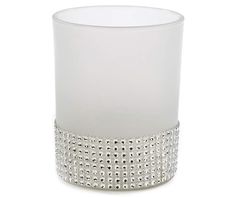 a white candle holder with silver trimmings on the bottom and sides, in front of a white background