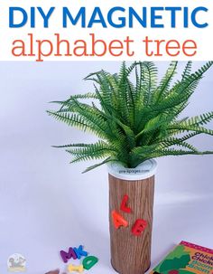 a plant in a wooden vase with magnets on it and the words diy magnetic alphabet tree next to it