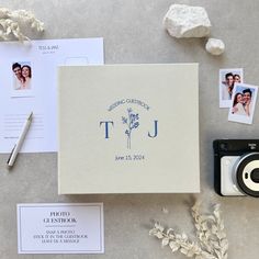 a couple's wedding photo and other items are laid out on the table next to each other