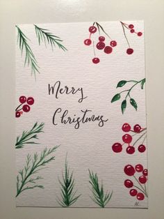 watercolor christmas card with berries and evergreens on white paper that says merry christmas