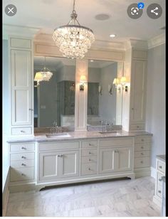 a large bathroom with double sinks and two mirrors