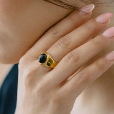 A modern interpretation of the classic signet ring, featuring a striking black onyx stone set in a bold gold-plated setting. The smooth, domed stone and architectural design create a sophisticated statement piece that commands attention. Specifications: Finish: 18K gold platedCore: Titanium steelGemstone: Black Onyx or Opal Black Onyx Stone, Solid Gold Jewelry, Ring Fit, Onyx Stone, Recycled Gold, Precious Jewelry, Fabric Jewelry, Architectural Design, Gold Plated Jewelry