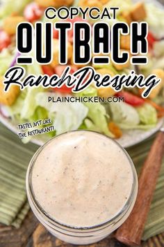 a bowl of ranch dressing next to a plate of salad