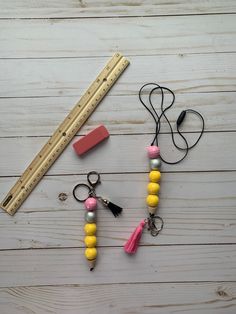 some beads and a ruler on a table