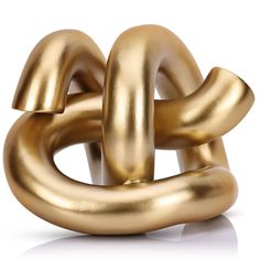 a gold metal object that looks like an interlocked chain on a white background