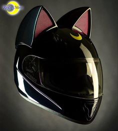 a helmet with a cat's face on it is shown in the dark background