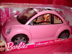 a pink toy car is on display in a plastic case with barbie's logo