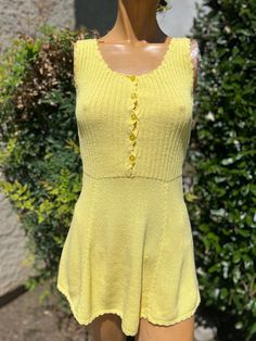 Here is the vintage 1970s knit tennis dress .Made by Catalina. Following are the measurements.Bust 32"-34",waist 28",hips full,length measured from top of shoulder to bottom 29".Bright yellow knit.Buttons 3/4 down the front.In nice vintage condition.Please take note tennis dresses were very short . Barely covering the bum. Not like a regular dress.Please e mail me if you live overseas for mailing cost before purchasing.Shipping price quoted is for USA only Tennis Dresses, Womens Sports, Yellow Knit, Tennis Dress, Bright Yellow, Vintage 1970s, Sports Women, Sport Fitness, Favorite Outfit