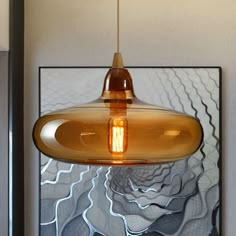 a light hanging from a ceiling in a room