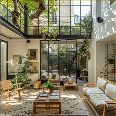 a living room filled with lots of furniture and plants on top of it's walls