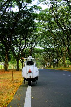 three different shots of a car parked on the side of the road in front of trees