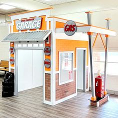 an orange and white gas station with benches