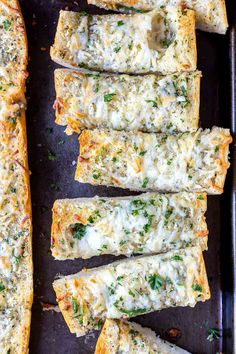 cheesy garlic bread sticks on a baking sheet