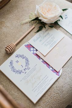 the wedding stationery is laid out on the table