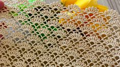 crocheted doily being worked on with scissors