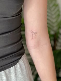 a person with a small tattoo on their arm