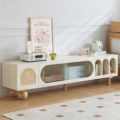 a living room with a white entertainment center