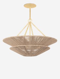 the large chandelier is made out of wicker and gold chain, with a circular