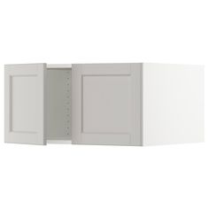 a white cabinet with two doors open on the wall