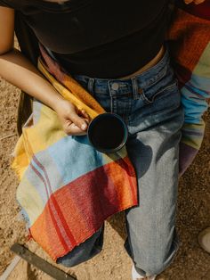 a woman holding a coffee cup in her hands