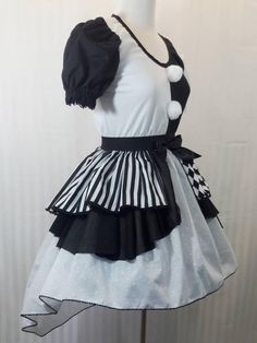 a mannequin wearing a dress with black and white stripes