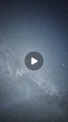 the sky is filled with stars and there is a video playing button