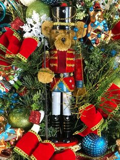 a nutcracker is surrounded by christmas decorations