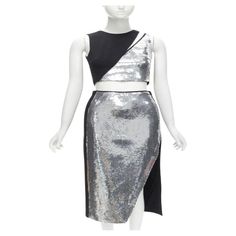 DAVID KOMA silver sequins midriff crop top asymmetric high slit skirt set UK6 XS Reference: AAWC/A00345 Brand: David Koma Collection: Runway Material: Acrylic, Blend Color: Silver, Black Pattern: Solid Closure: Zip Lining: Fabric Made in: United Kingdom CONDITION: Condition: Excellent, this item was pre-owned and is in excellent condition. One sequin missing near left shoulder and one missing near middle of slit. SIZING Designer size: UK6 Size reference: US0 / UK6 / IT38 / FR34 / XXS-XS MEASUREMENTS: Shoulder to shoulder: 27cm / 10.5" Chest: 37cm / 14.4" Waist: 31cm / 12.1" Hip: 42cm / 16.4" Length: 82cm / 32" This David Koma item is authentic. Zip Lining, David Koma, Silver Sequin, Black Pattern, Skirt Set, Evening Dresses, Cocktail Dress, Crop Top, Fashion Outfits