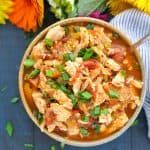 a bowl of chicken tortilla soup on a table