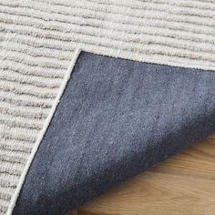 a close up view of an area rug that has been made with denim and wool