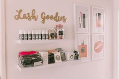 a shelf with cosmetics and personal care items on it next to a sign that says lashes goodies