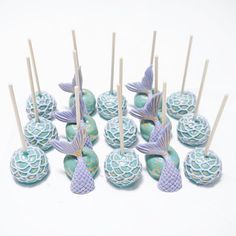 there are many little mermaid candies on the stick with toothpicks in them