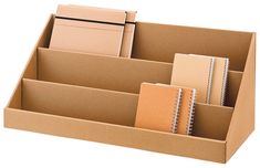 an open cardboard box with three dividers and two notebooks in it, on a white background